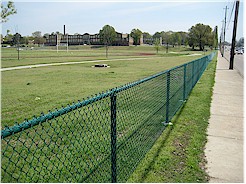 Fence along southern edge of East High Campus between the athletic fields and Poplar Avenue.