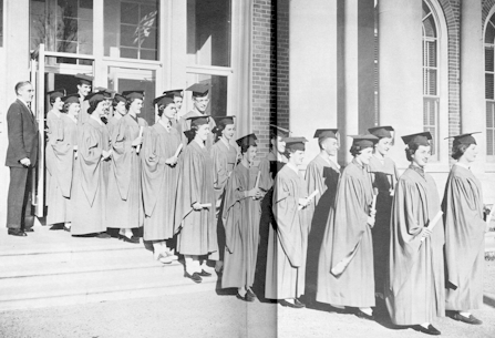 High School Prinicipal J.P. Snider watches graduates as they exit East High School.