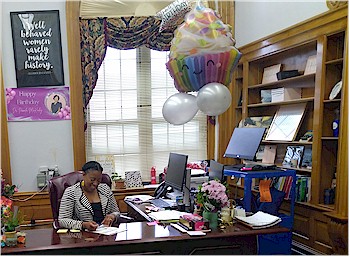 Principal Pamela McKinley, at desk, 2024