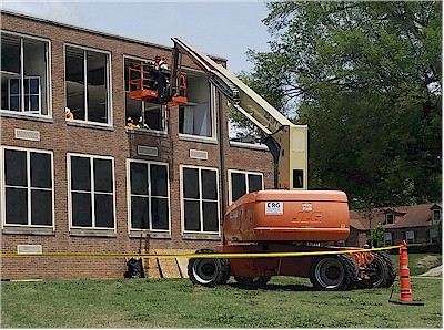 Windows being replace on main building.